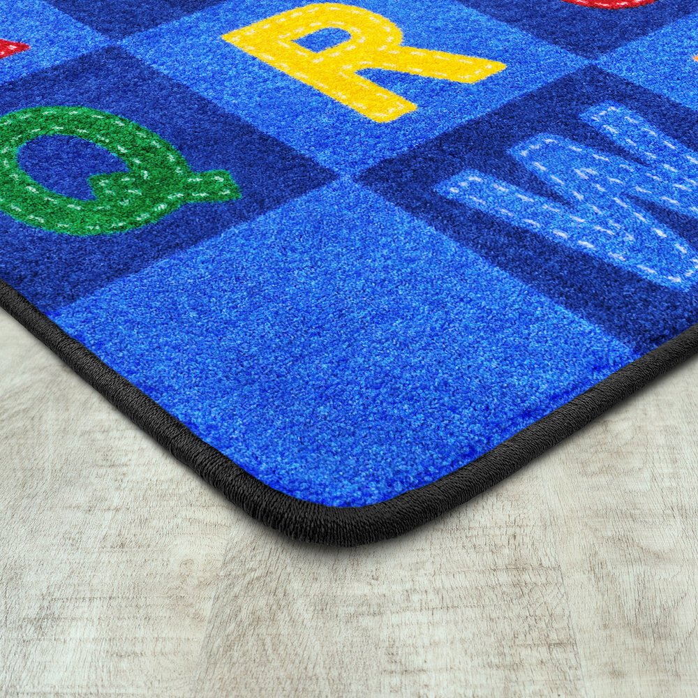 Kid Essentials Patchwork Letters 5'4" x 7'8" Area Rug in Color Multi