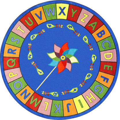 Kid Essentials Alphabet Pinwheel 7'7" Round Area Rug in Color Multi