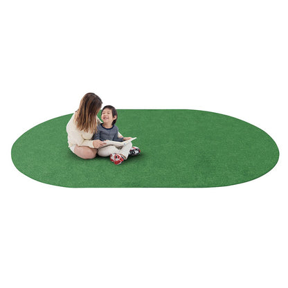Kid Essentials Just Kidding 6' x 9' Oval Area Rug in Color Grass Green