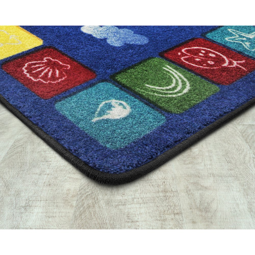 Kid Essentials One World 5'4" x 7'8" Area Rug in Color Primary