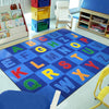 Kid Essentials Patchwork Letters 5'4" x 7'8" Area Rug in Color Multi
